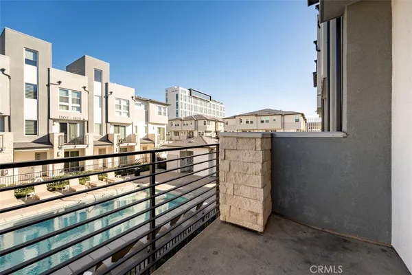a view of a balcony and car parked