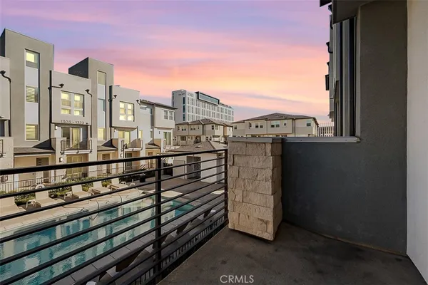 a kitchen with granite countertop a sink and steel appliances