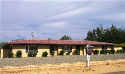 14635 Pamlico Road Apple Valley, CA 92307 - Photo 1 of 1 a front view of a house with a yard