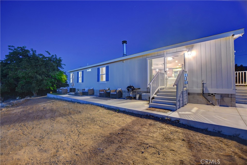 1330 Tamarack Road Pinon Hills, CA 92372 - Photo 10 of 19 a view of a backyard with a patio