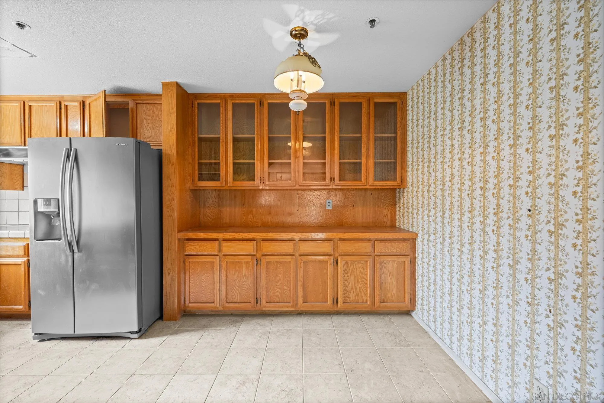 5665 Friars Road, Unit 232 San Diego, CA 92110 - Photo 14 of 30 a kitchen with stainless steel appliances granite countertop a refrigerator and a sink