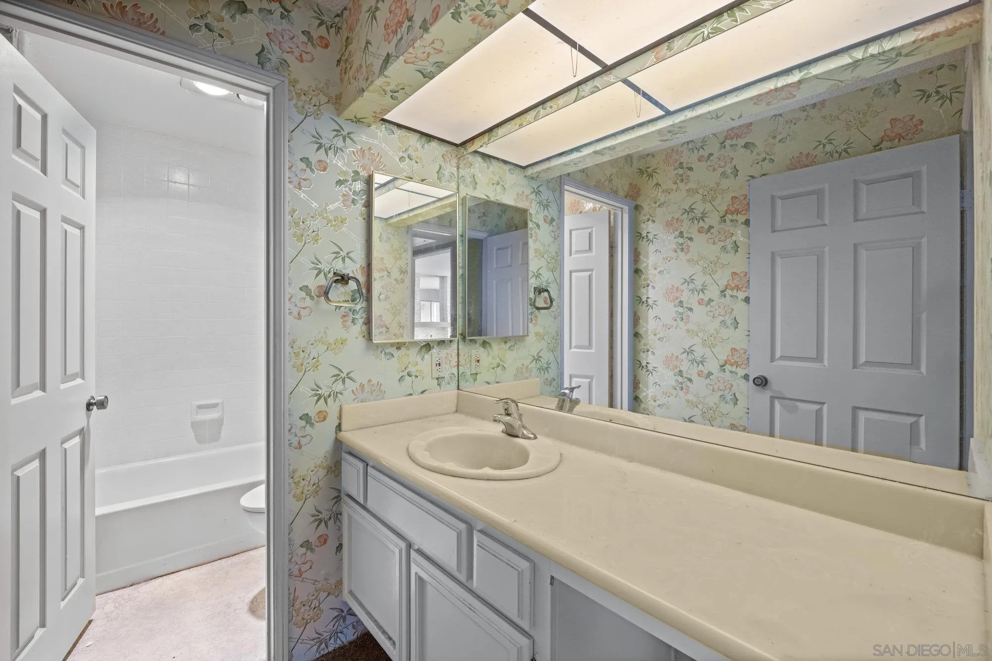 5665 Friars Road, Unit 232 San Diego, CA 92110 - Photo 22 of 30 a bathroom with a sink and a mirror