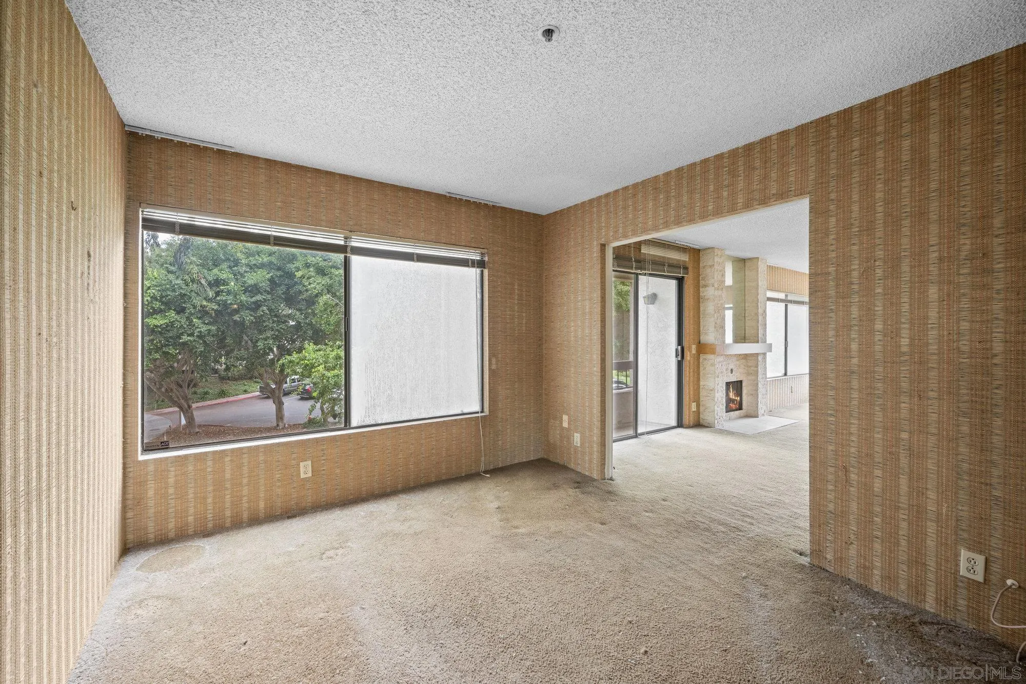5665 Friars Road, Unit 232 San Diego, CA 92110 - Photo 24 of 30 an empty room with windows and entrance
