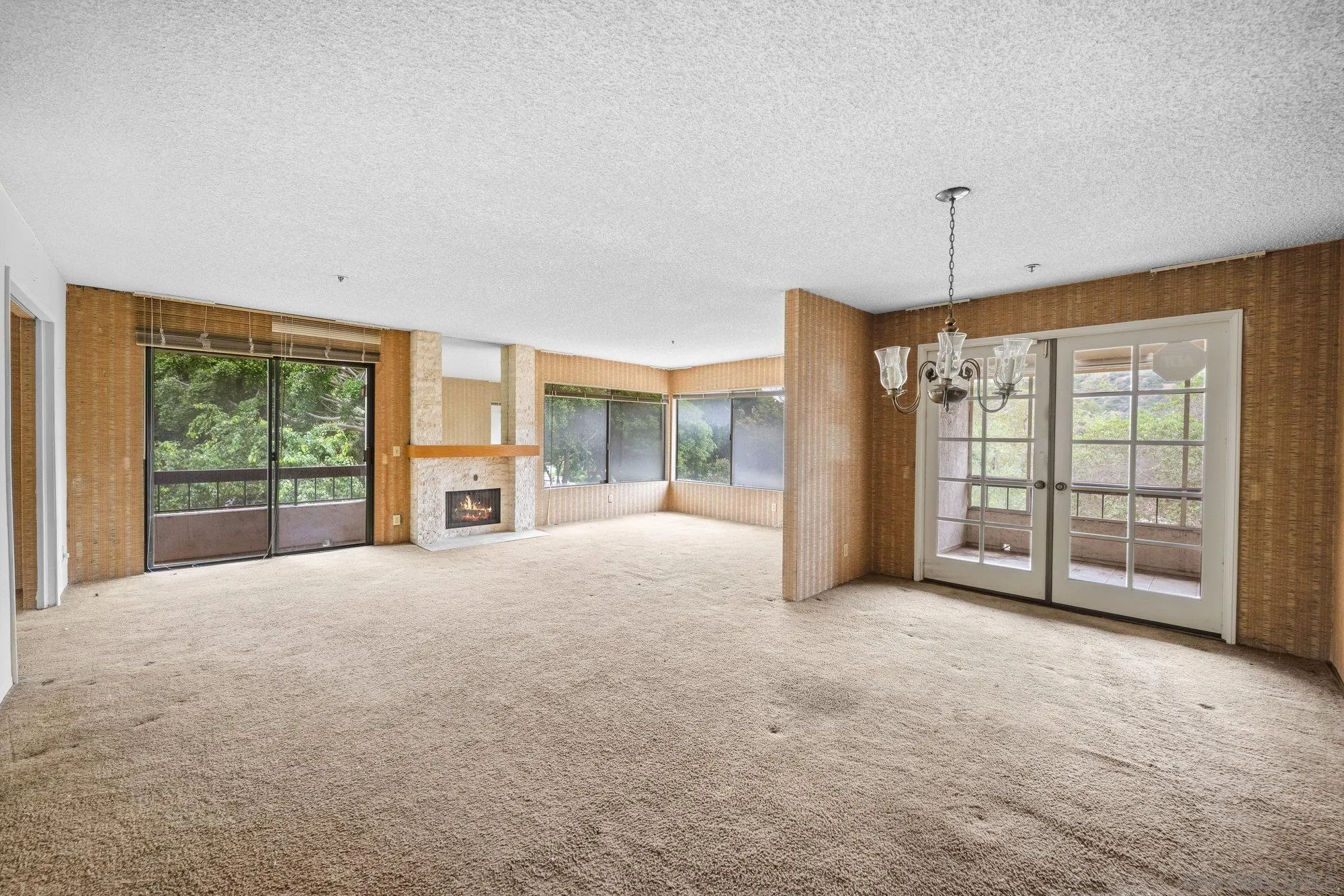 5665 Friars Road, Unit 232 San Diego, CA 92110 - Photo 9 of 30 a view of an empty room with a sliding door