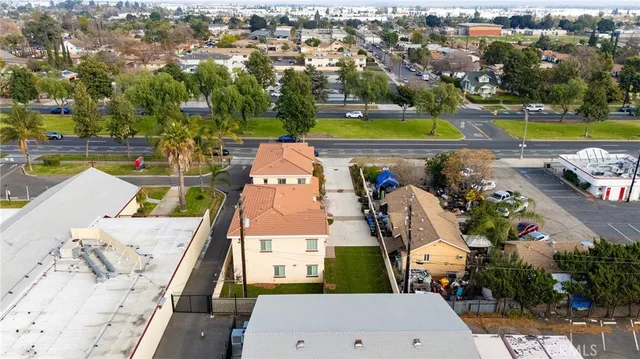 an aerial view of a house with a swimming pool yard and outdoor seating