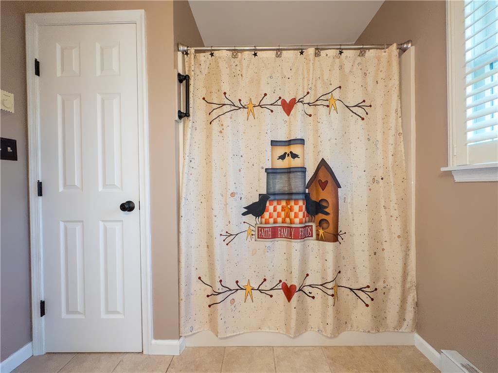 1644 9th Street Bethlehem, PA 18020 - Photo 15 of 27 The bathroom features a privacy window and durable tiled flooring.