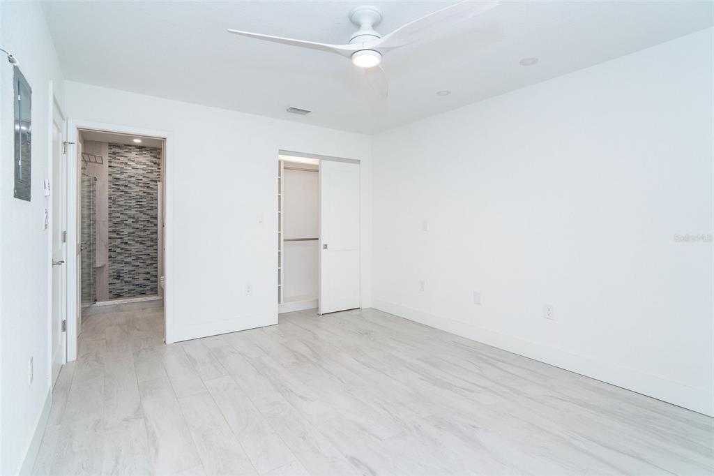 2700 North Beach Road, Unit A201 Englewood, FL 34223 - Photo 11 of 55 an empty room with closet and a ceiling fan