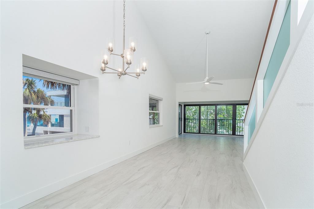 2700 North Beach Road, Unit A201 Englewood, FL 34223 - Photo 18 of 55 wooden floor in an empty room with a window