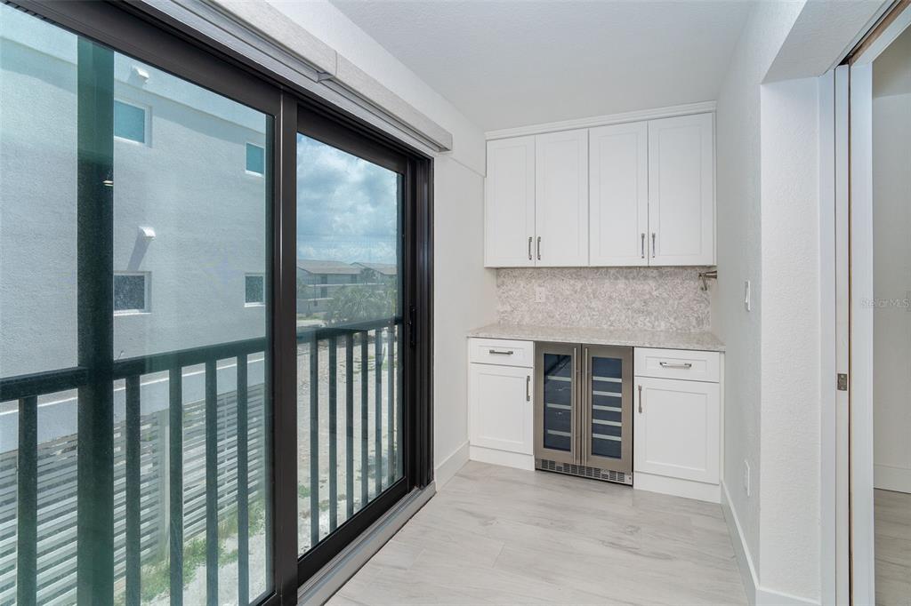 2700 North Beach Road, Unit A201 Englewood, FL 34223 - Photo 24 of 55 a view of a kitchen from the hallway