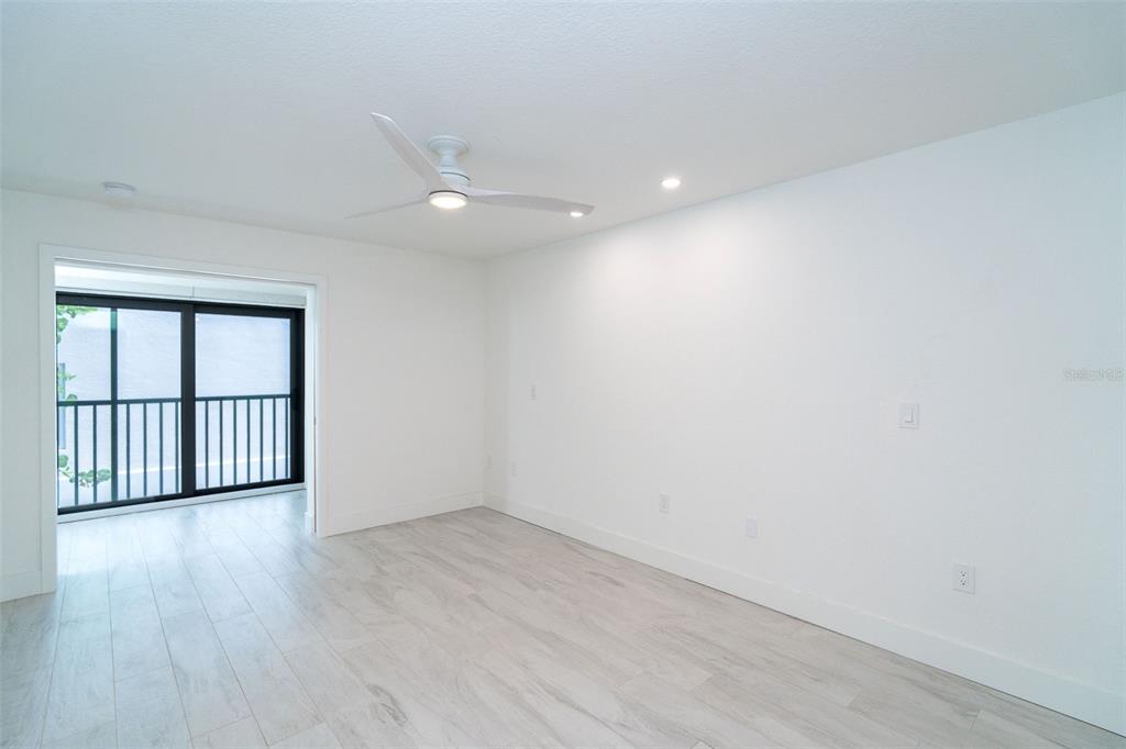 2700 North Beach Road, Unit A201 Englewood, FL 34223 - Photo 26 of 55 wooden floor in an empty room with a window