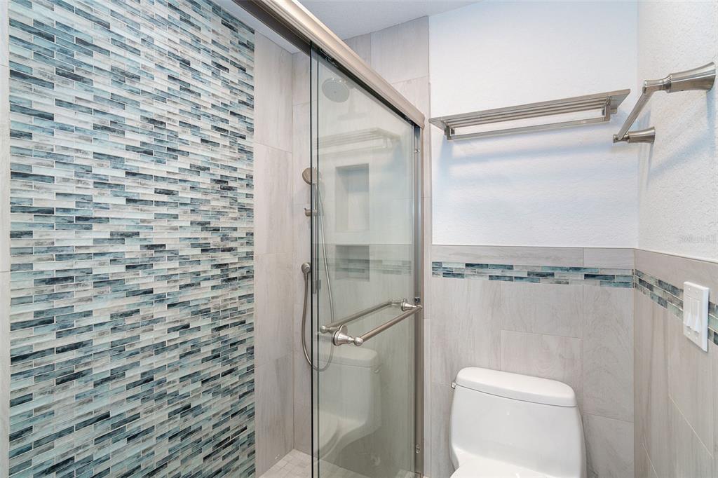 2700 North Beach Road, Unit A201 Englewood, FL 34223 - Photo 31 of 55 a bathroom with a shower and toilet