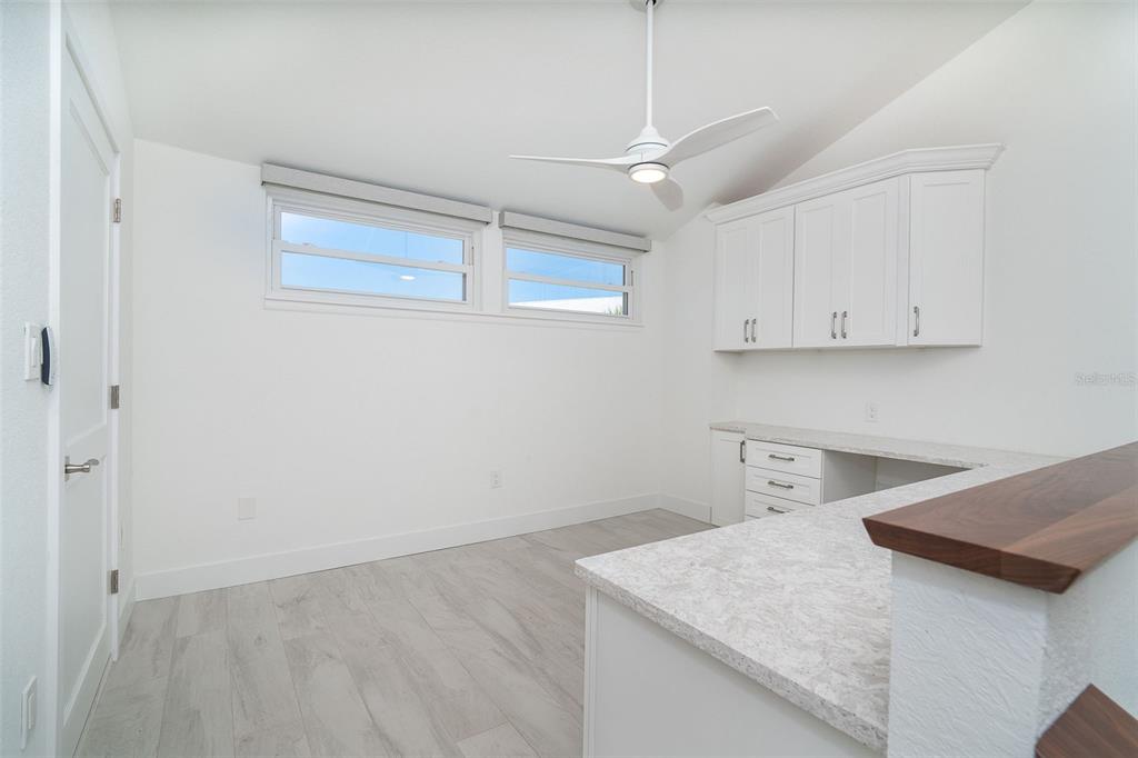2700 North Beach Road, Unit A201 Englewood, FL 34223 - Photo 36 of 55 a view of a kitchen with marble countertop