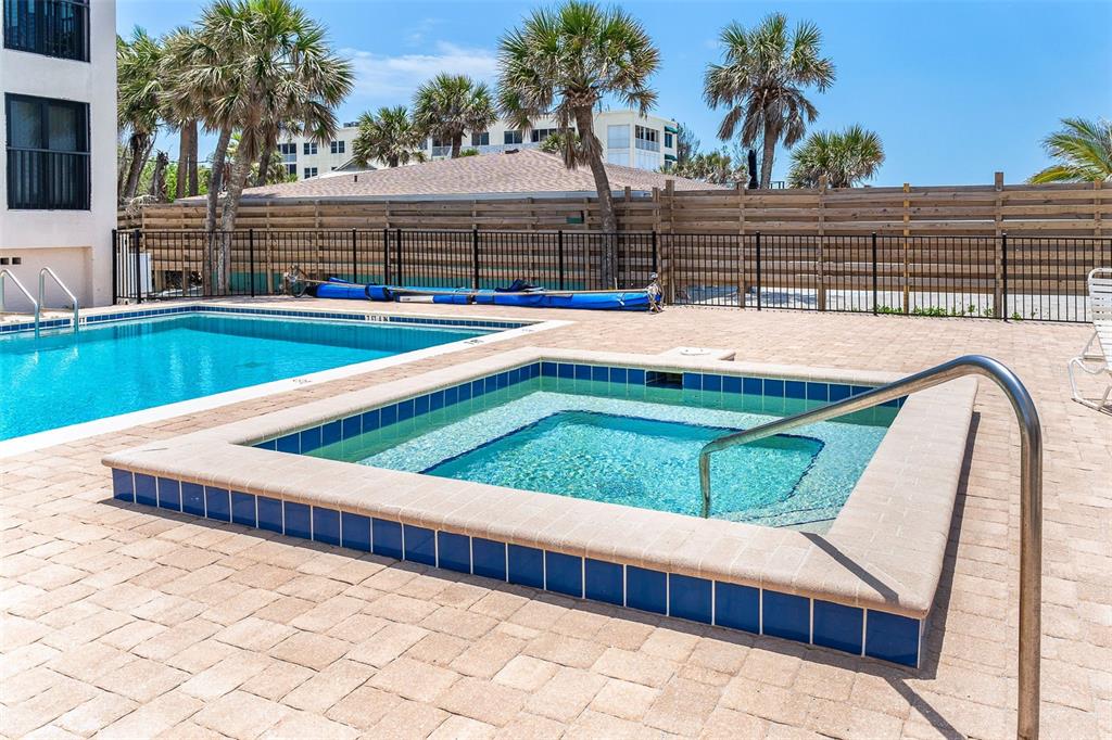2700 North Beach Road, Unit A201 Englewood, FL 34223 - Photo 48 of 55 a view of swimming pool with outdoor seating and yard