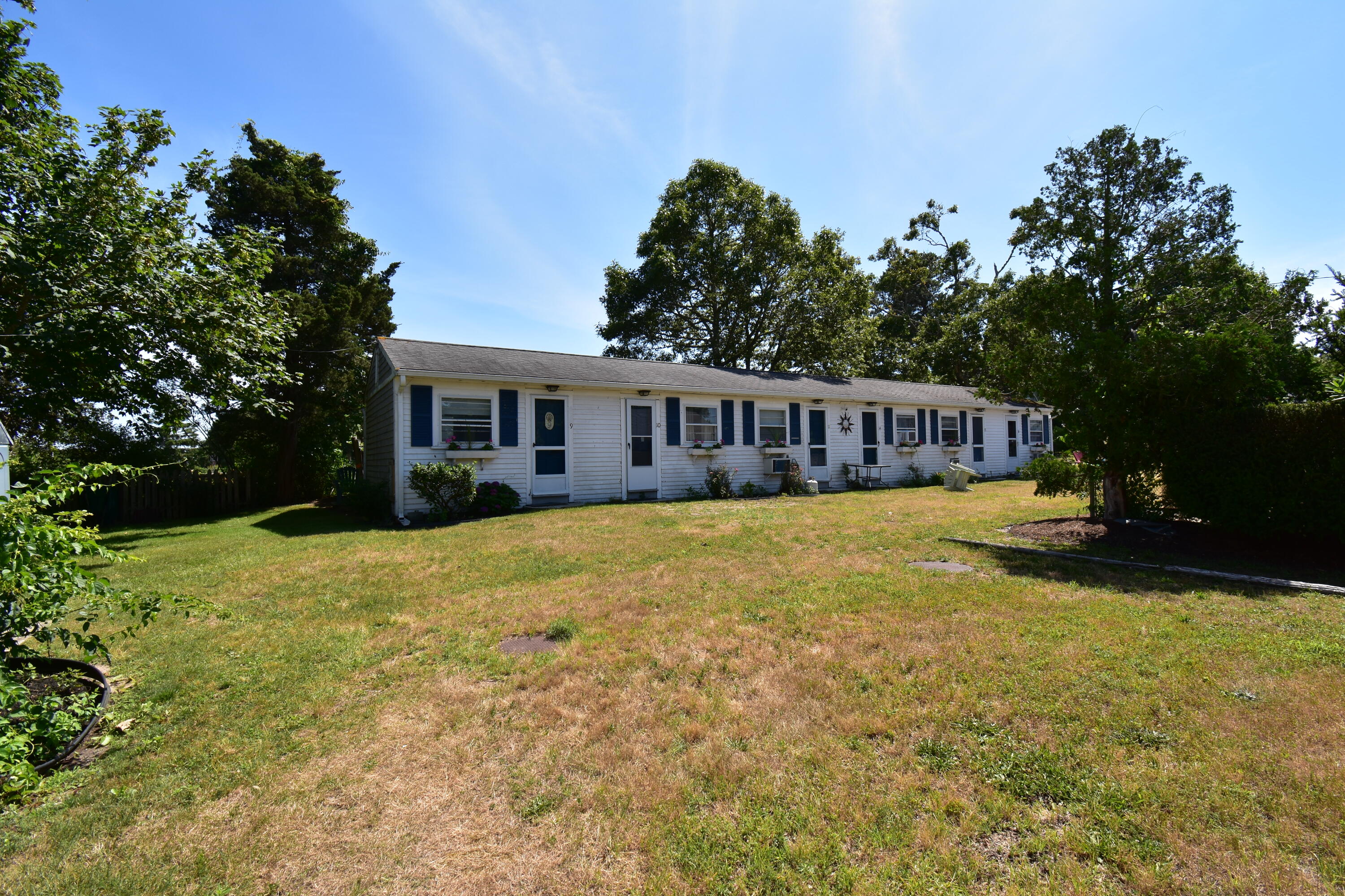 465 Lower County Road, Unit 10B Dennis Port, MA 02639 - Photo 1 of 29 a view of a house with swimming pool and sitting area