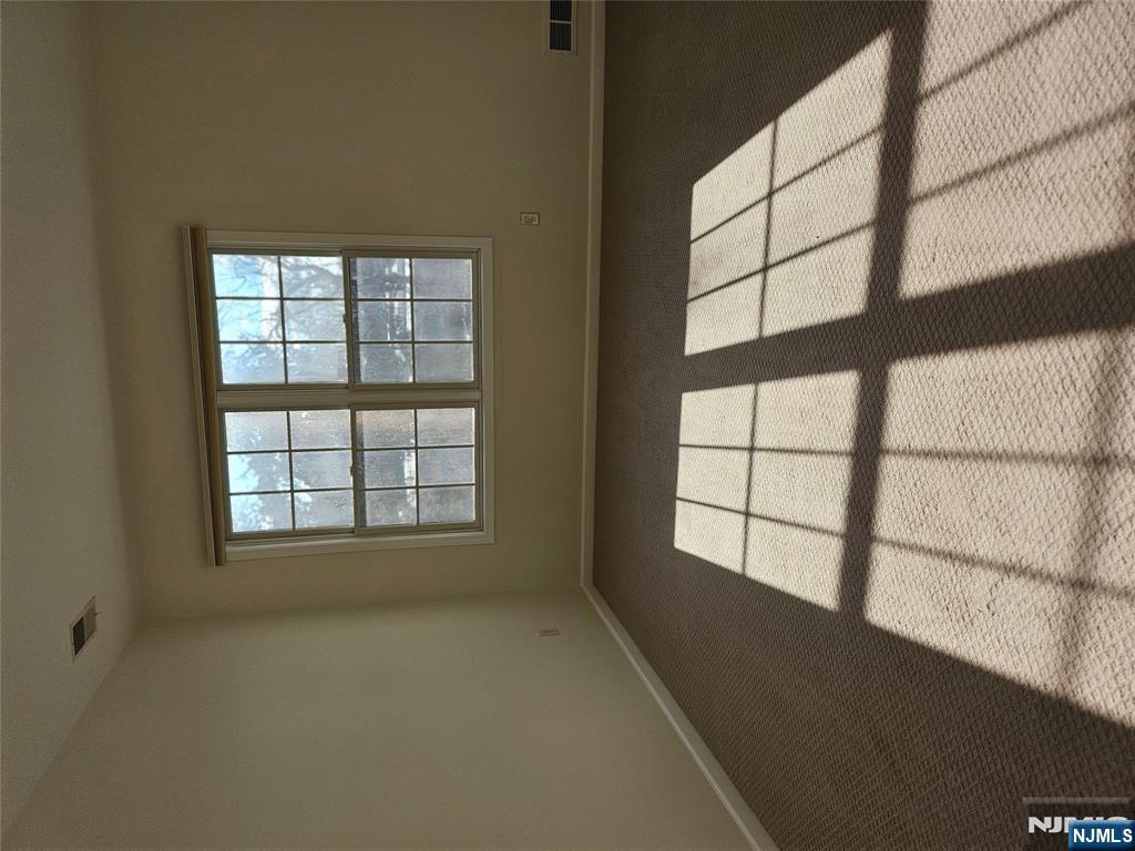 80 Ridgewood Road, Unit 212 Tenafly, NJ 07670 - Photo 12 of 14 a view of an empty room with a window