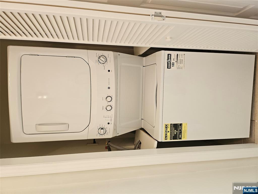 80 Ridgewood Road, Unit 212 Tenafly, NJ 07670 - Photo 13 of 14 a utility room with dryer and washer