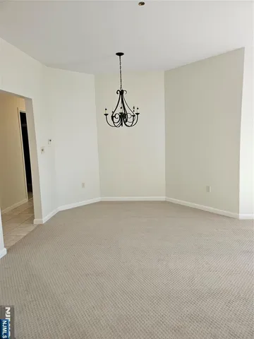 a view of a room with a hanging light