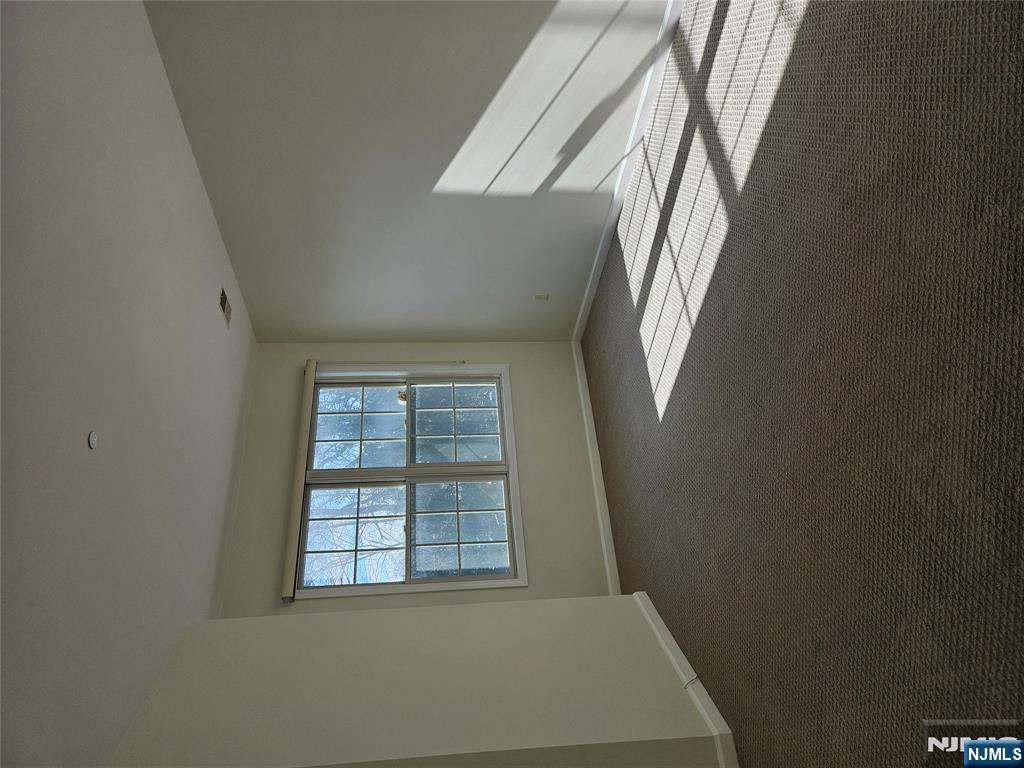 80 Ridgewood Road, Unit 212 Tenafly, NJ 07670 - Photo 10 of 14 a view of empty room with window