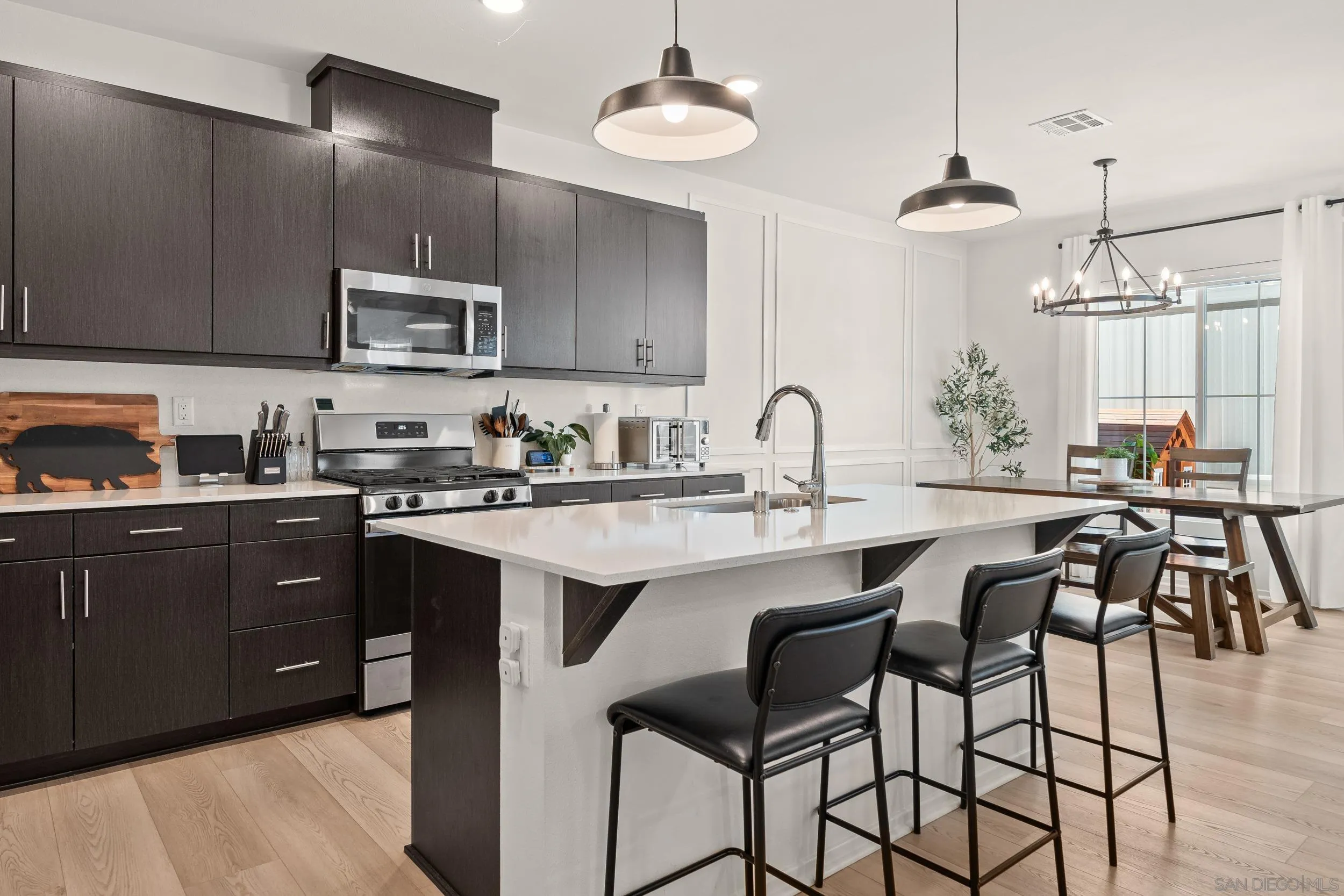 232 Perennial Place Fallbrook, CA 92028 - Photo 12 of 49 a kitchen with cabinets a sink and appliances