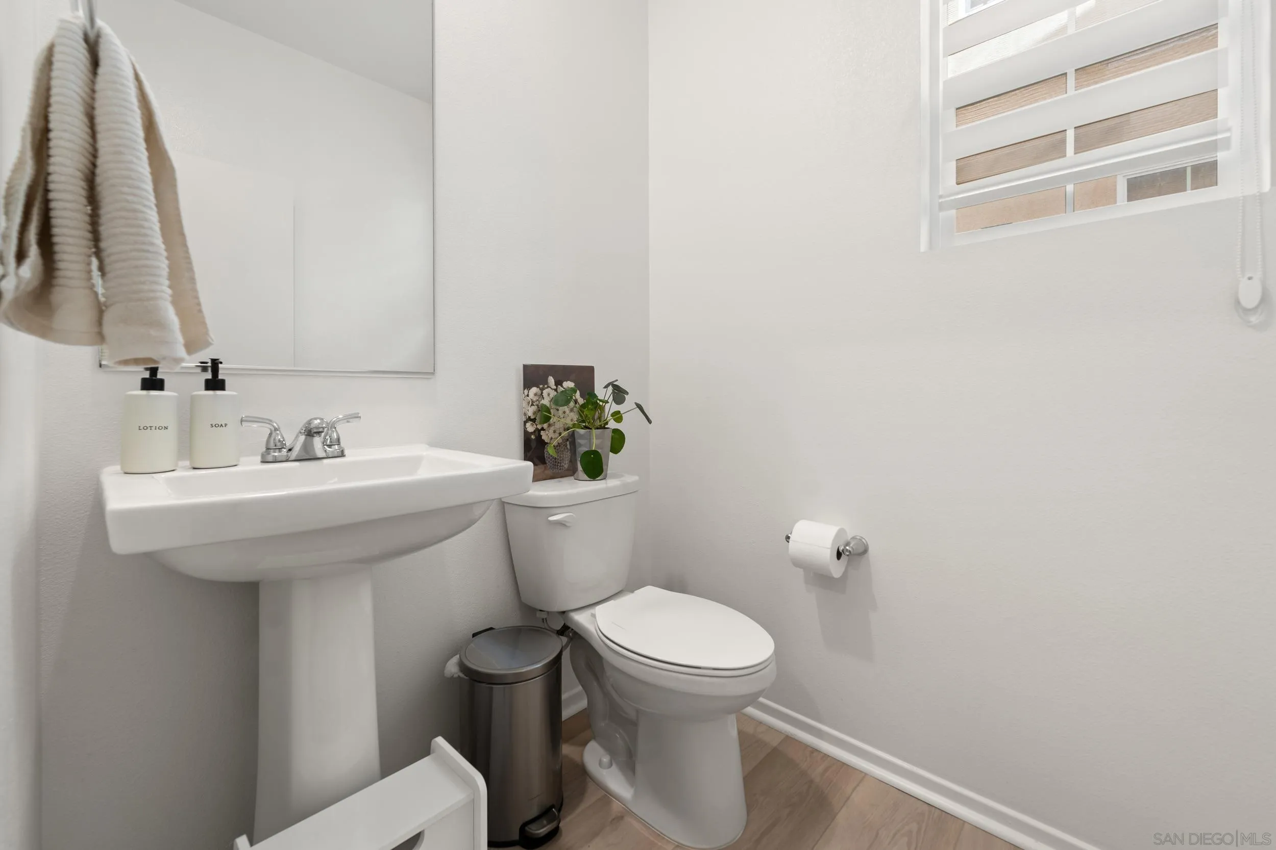 232 Perennial Place Fallbrook, CA 92028 - Photo 16 of 49 a bathroom with a sink a toilet and a mirror