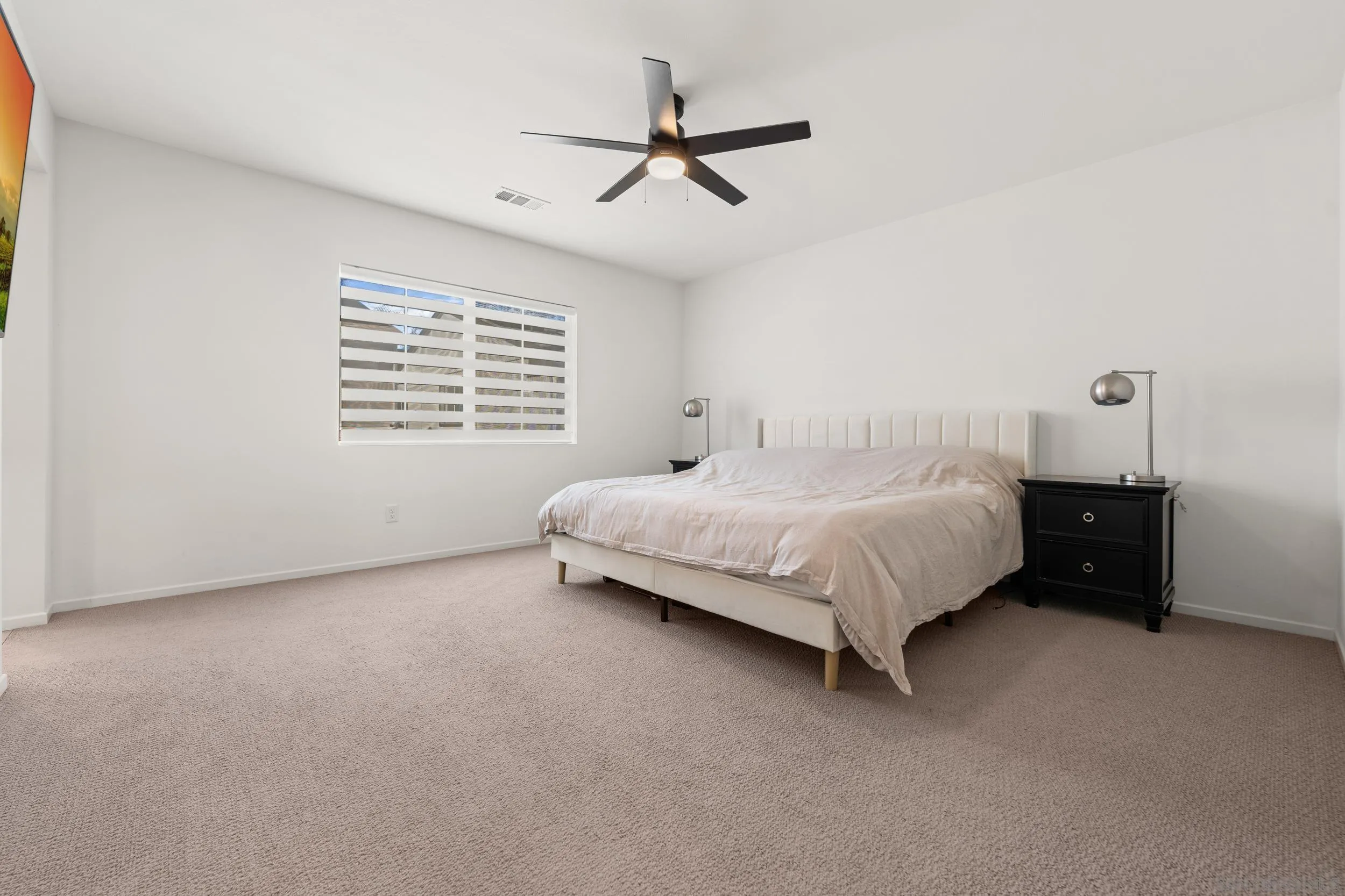 232 Perennial Place Fallbrook, CA 92028 - Photo 18 of 49 a bed sitting in a bedroom next to a window