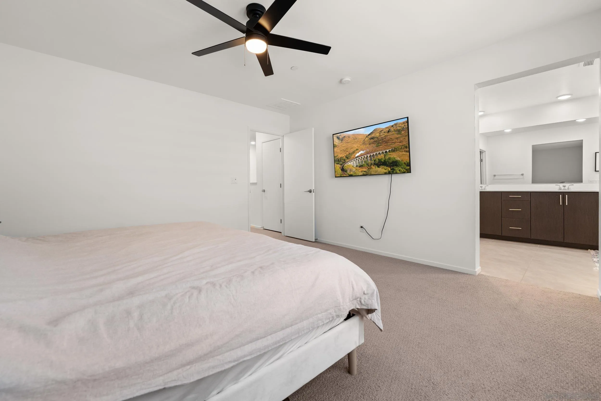 232 Perennial Place Fallbrook, CA 92028 - Photo 20 of 49 a bedroom with a bed and a chandelier