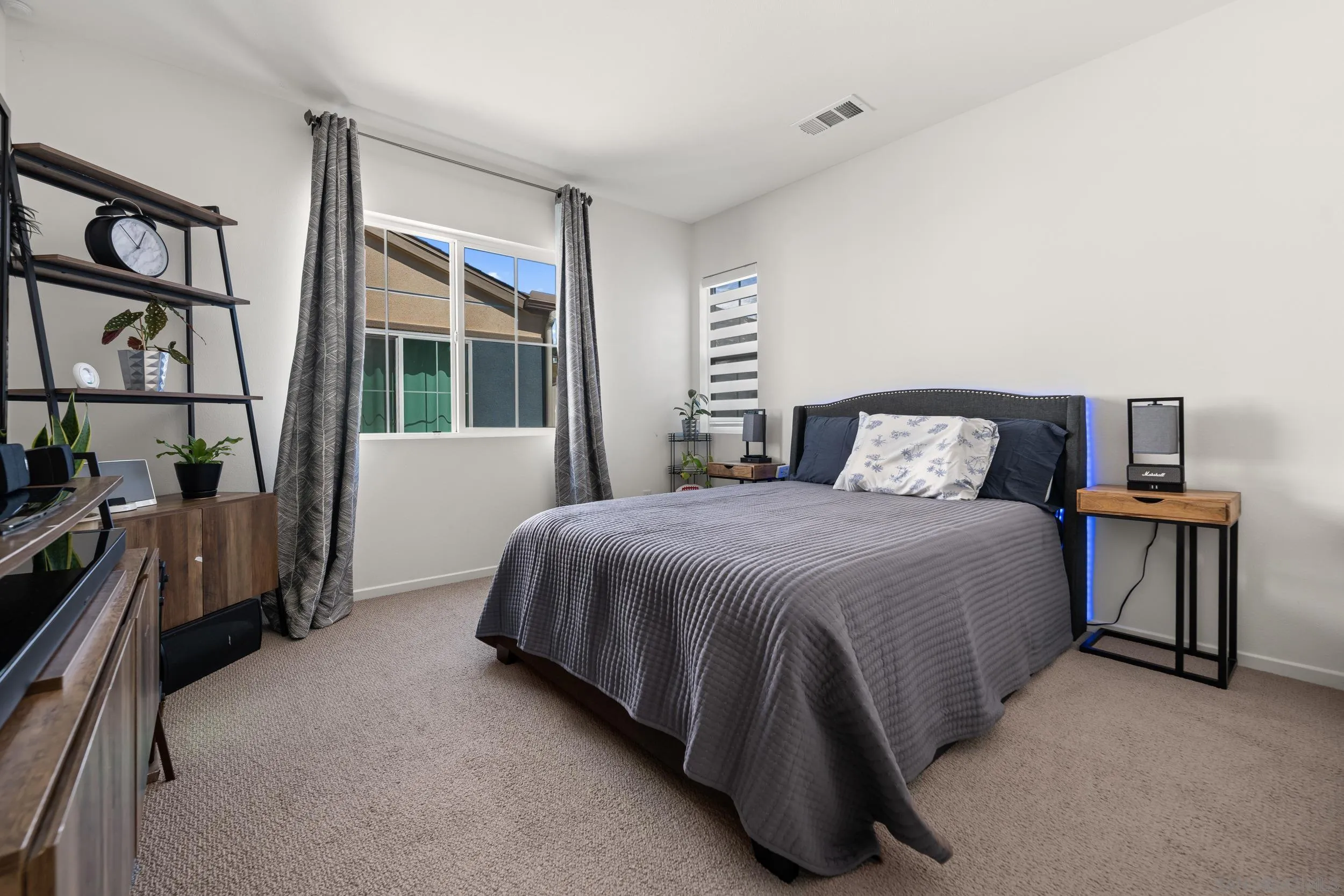 232 Perennial Place Fallbrook, CA 92028 - Photo 25 of 49 a bedroom with a bed next to a window