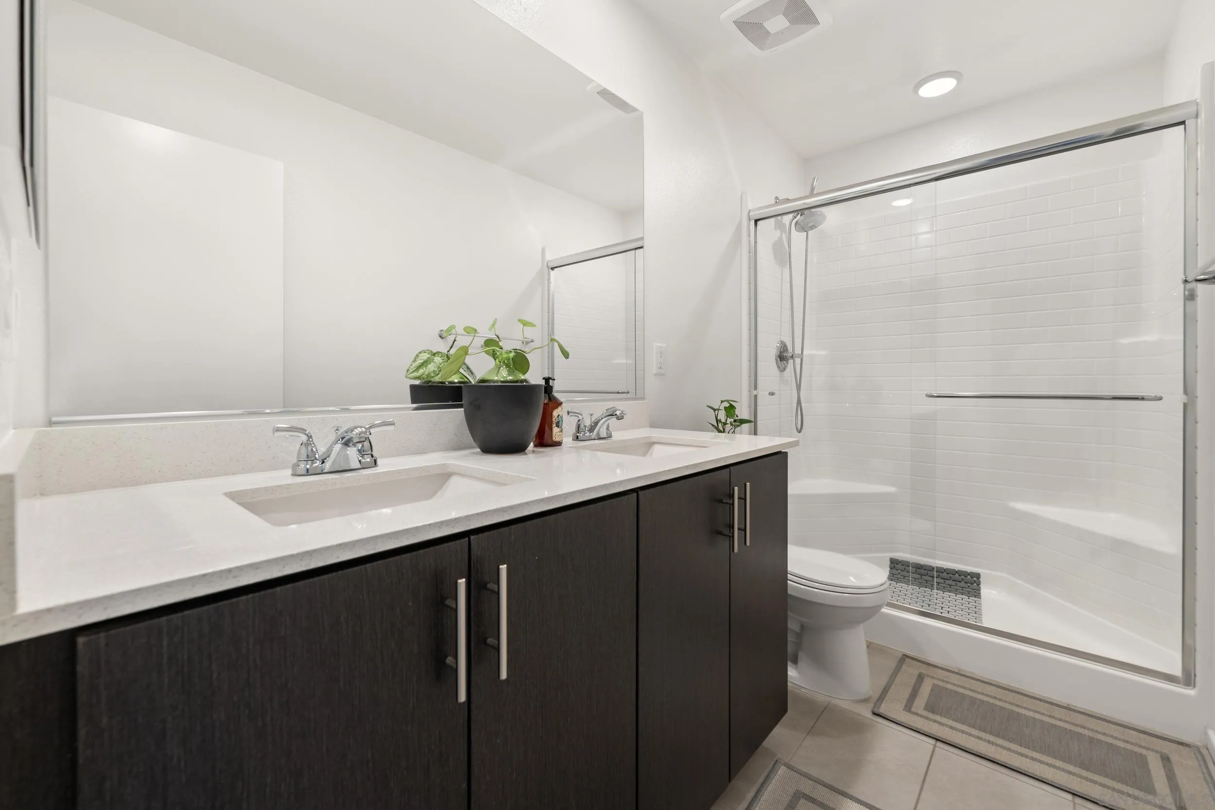 232 Perennial Place Fallbrook, CA 92028 - Photo 27 of 49 a bathroom with a sink and a mirror