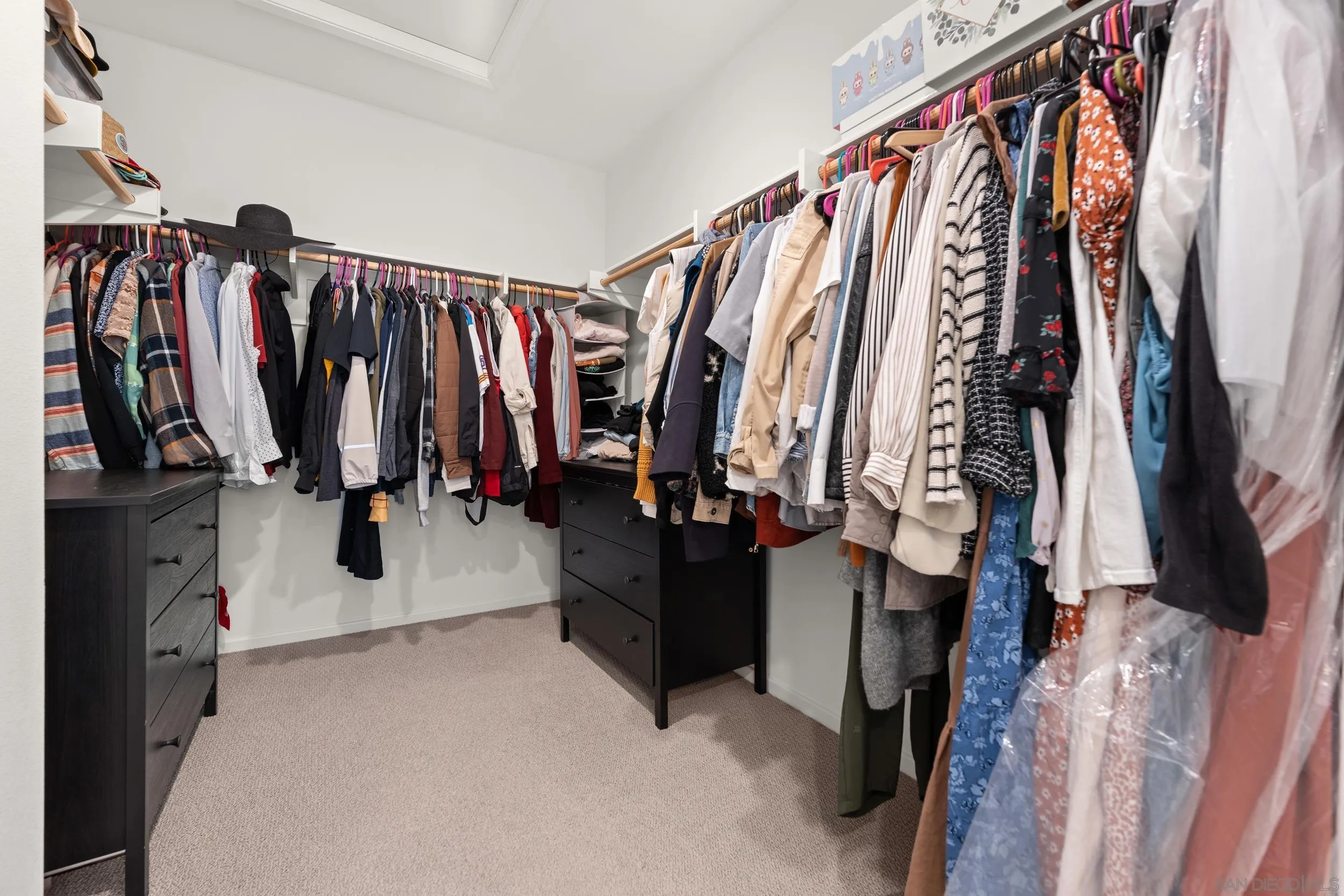 232 Perennial Place Fallbrook, CA 92028 - Photo 32 of 49 a view of walk in closet with clothes and shoes