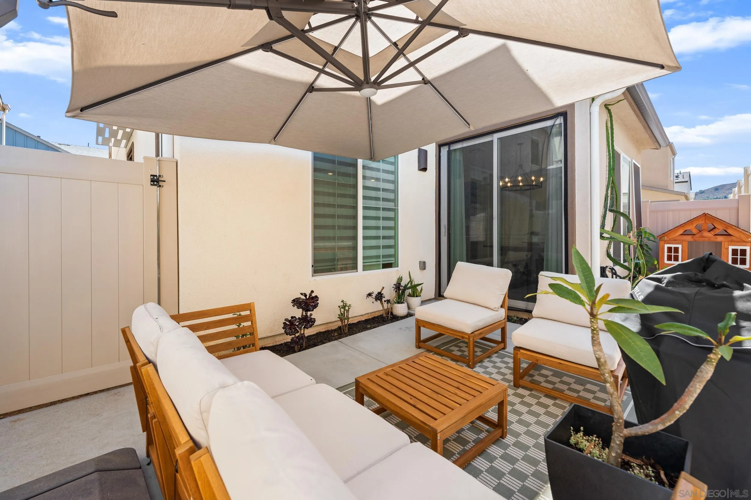 232 Perennial Place Fallbrook, CA 92028 - Photo 38 of 49 a outdoor space with patio the couches and pool with an umbrella