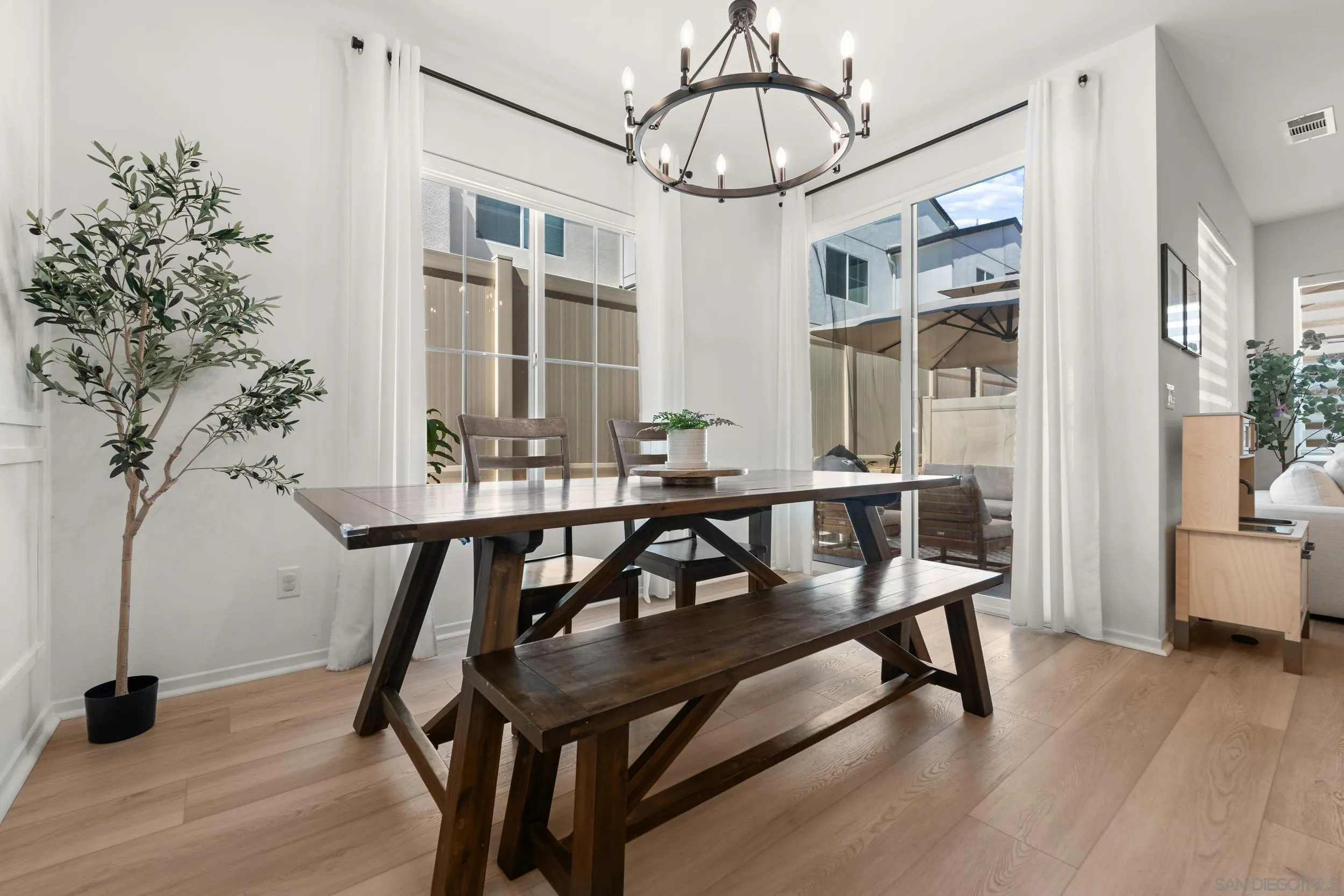 232 Perennial Place Fallbrook, CA 92028 - Photo 9 of 49 a view of a dining room with furniture window and wooden floor