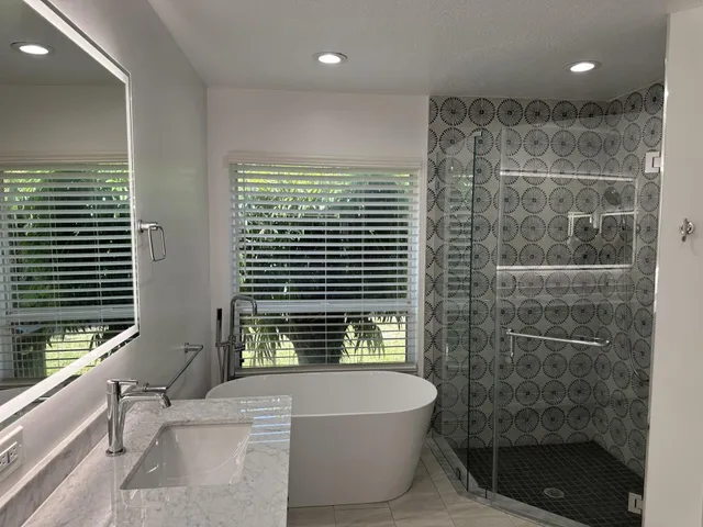 a bathroom with a bathtub and a shower