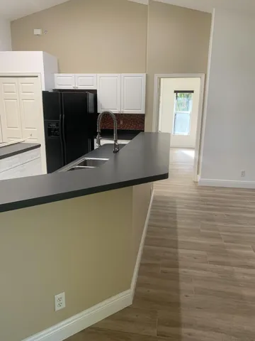 a view of a kitchen from the hallway