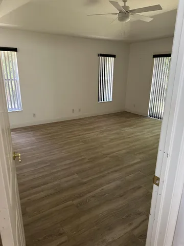 a view of an empty room with a window