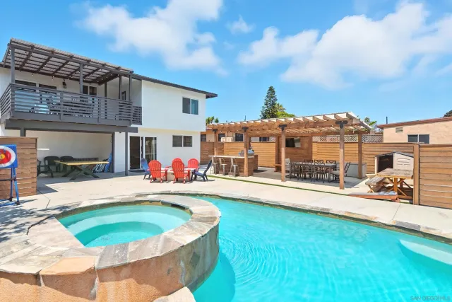 a view of a swimming pool with a patio