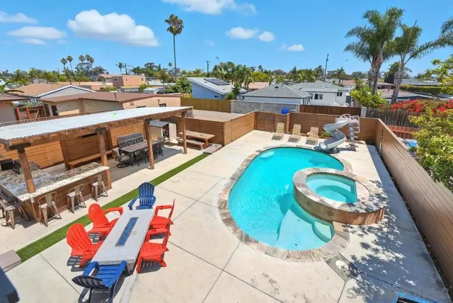 a view of a swimming pool with a lounge chairs