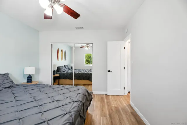 a bedroom with a bed and a dresser