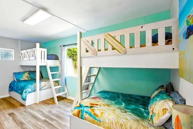 a bedroom with bed and a window