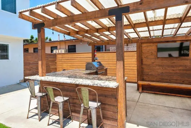 a kitchen view with table and chairs