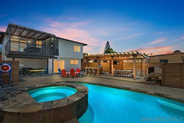 a view of a chairs and table in the patio