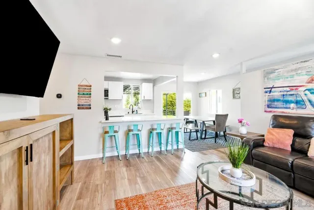 a living room with furniture fireplace and a flat screen tv
