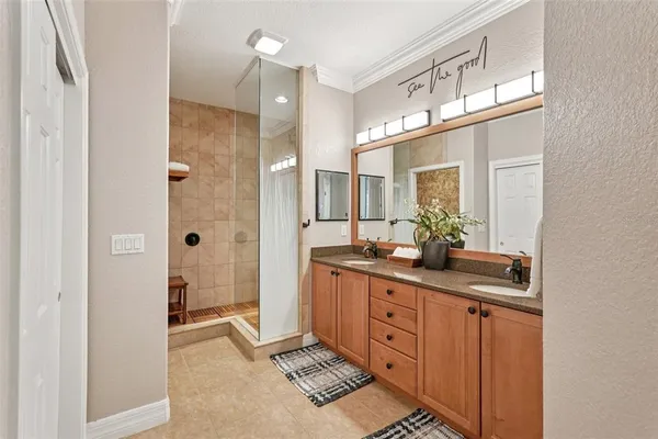 a living room with furniture ceiling fan and a window