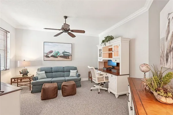a bathroom with a granite countertop sink a toilet and a mirror