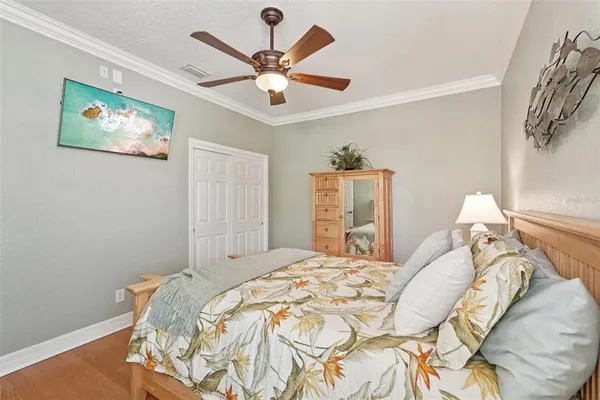 a bedroom with a bed and a dresser