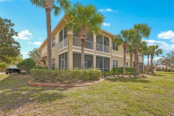 an aerial view of a house with outdoor space and lake view