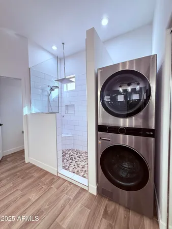 a view of a hallway with washer and dryer