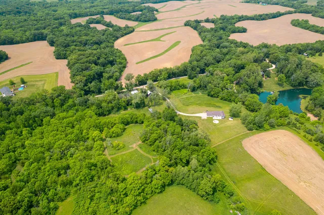 a view of a dining room with furniture and a chandelier