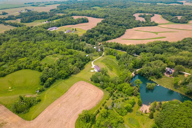a living room with furniture a dining table and a window