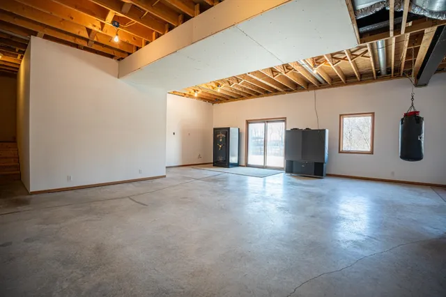 a view of a garage with a white car parked