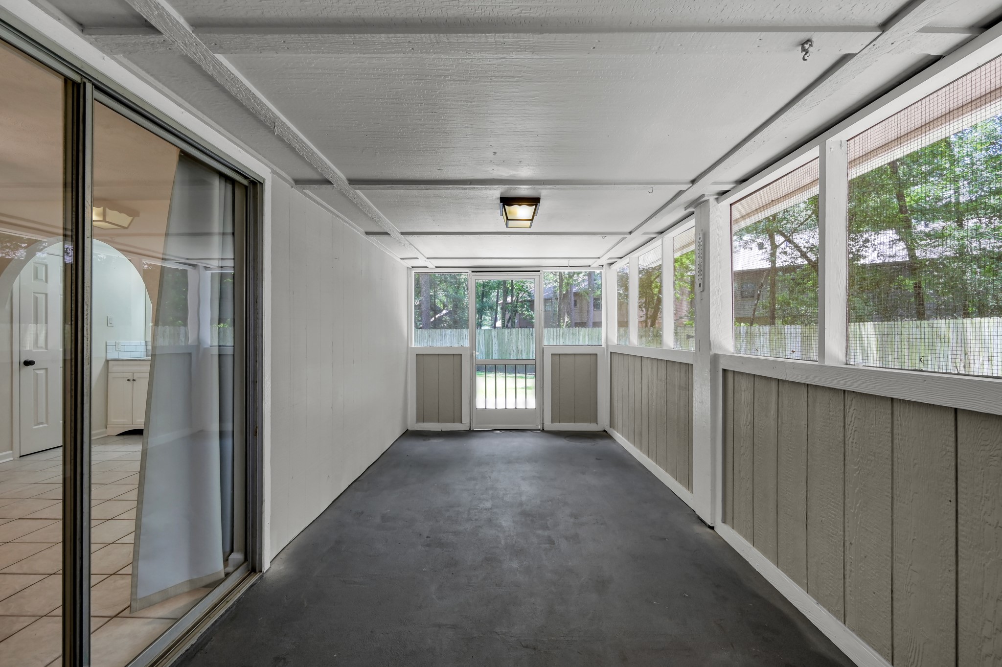 12224 Gun Oak Place Spring, TX 77380 - Photo 22 of 37 Expansive Screened Porch Perfect for Morning Coffee, Outdoor Dining, and Relaxing Evenings